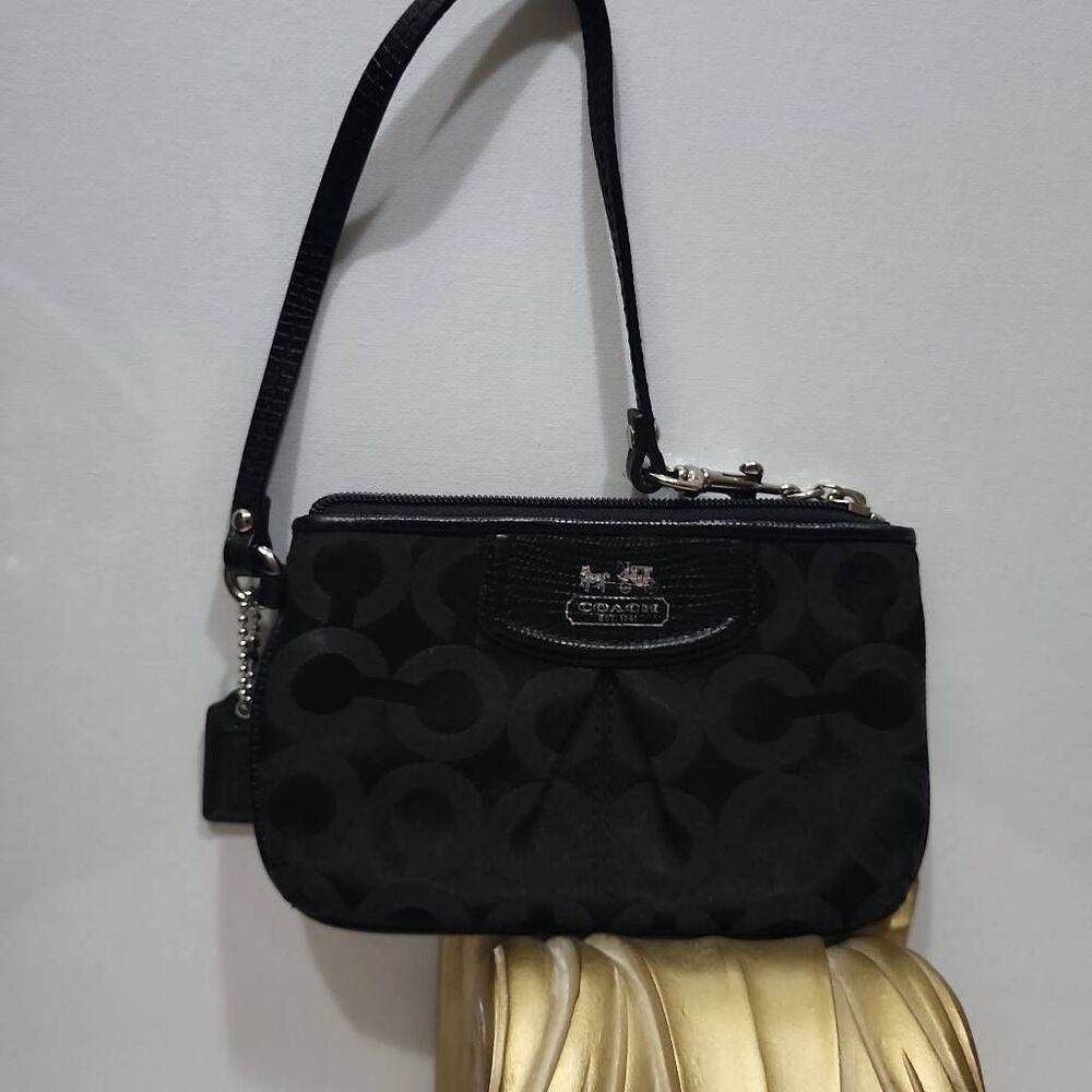 Coach Madison Signature C Wristlet in black.
